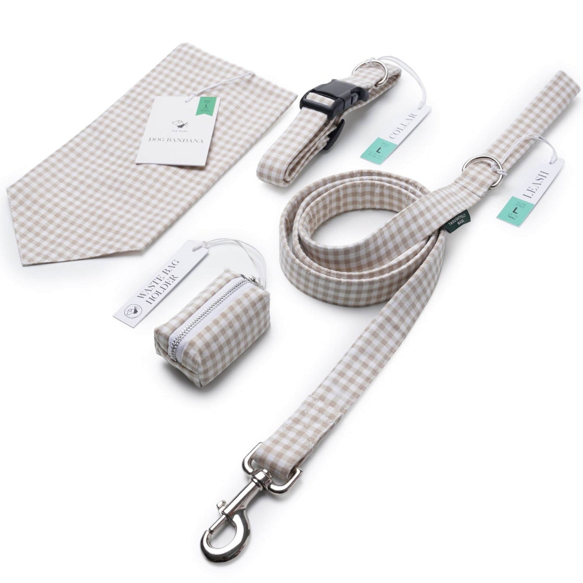 A matching pet accessory set including a leash, collar, small pouch, and folded fabric accessory, all in a beige and white gingham check pattern with silver metal hardware, photographed on a white background.