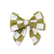 A green and white checkered sailor bow tie with elastic loops for attaching to a collar.