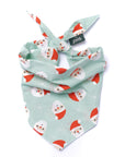 Dog bandana with snowman pattern on a light green background