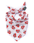 White bandana with red heart designs and text on a white background