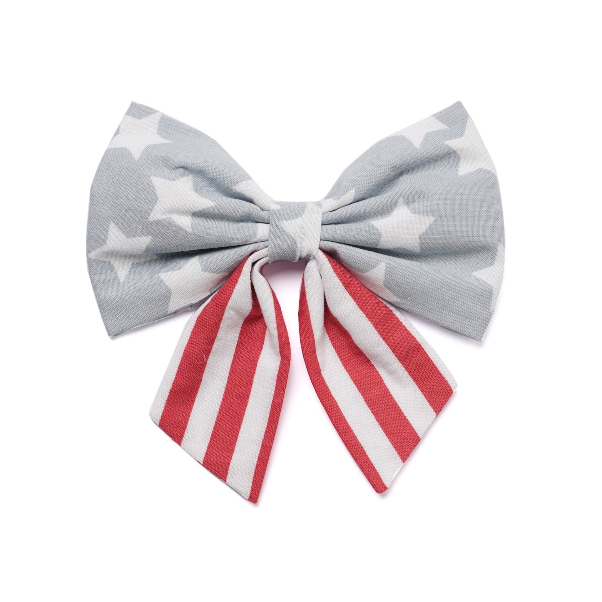 Bow with gray star pattern and red and white striped ribbon on a white background